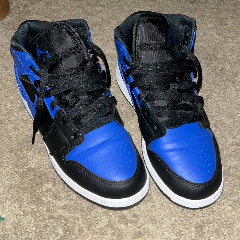 Blue and black Jordan Retro 1’s